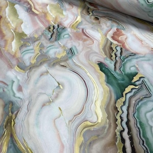 May include: Abstract fabric with a swirling pattern of pink, green, and gold. The fabric has a marble-like appearance.