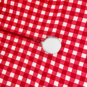 Tablecloth with umbrella hole. Waterproof outdoor tablecloth with cell. Teflon retains spilled liquids on the surface. Red cell tablecloth.