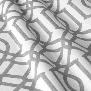 May include: White fabric with a gray geometric pattern of interlocking circles and lines.