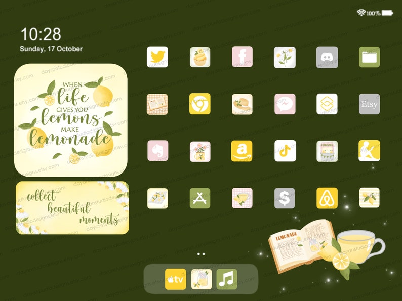 May include: A digital screen with a green background and a variety of app icons. The icons are in a grid pattern and feature images of lemons, teacups, and other objects. The text "WHEN life GIVES YOU lemons MAKE lemonade" is displayed on a yellow background with lemon illustrations.
