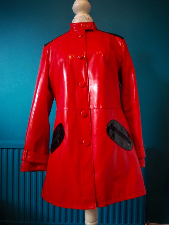 Bright red 60s style PVC vinyl raincoat