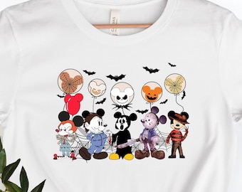 May include: White t-shirt with a graphic print of Mickey Mouse and friends dressed in Halloween costumes. The characters are holding balloons with spooky faces. The text "Boo!" is printed on the shirt.