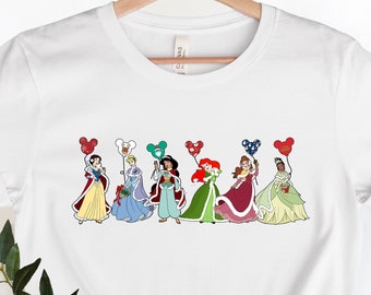 Camisas de Navidad de princesas de Disney, camisas de princesas de Disneyland, camisas de princesas de Disney, camisas de globos de Navidad de Disney, camisetas de princesas de Navidad