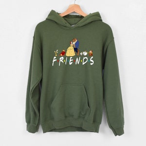 May include: Green hooded sweatshirt with a graphic print of characters from the Disney movie Beauty and the Beast. The text "FRIENDS" is printed below the characters.
