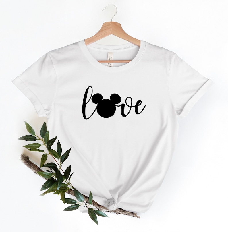 May include: White t-shirt with a black Mickey Mouse head and the word "love" in a cursive font.