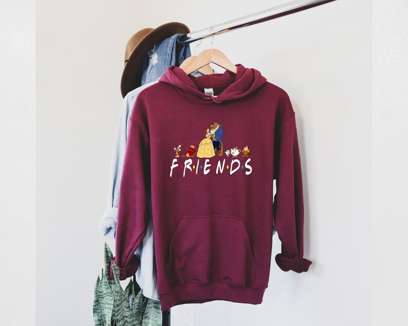 May include: Burgundy hoodie with a graphic of Belle and the Beast from Beauty and the Beast, along with other characters from the movie. The graphic says "FRIENDS".