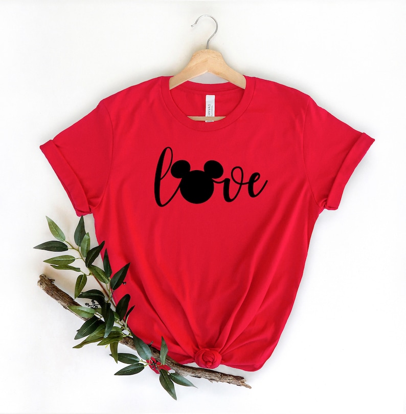 May include: Red t-shirt with a black Mickey Mouse head and the word "love" in a cursive font.