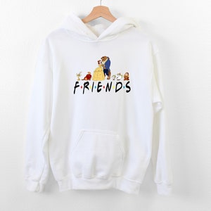 May include: White hoodie with a graphic of Belle and the Beast from Beauty and the Beast, along with other characters from the movie. The text "FRIENDS" is printed below the graphic.