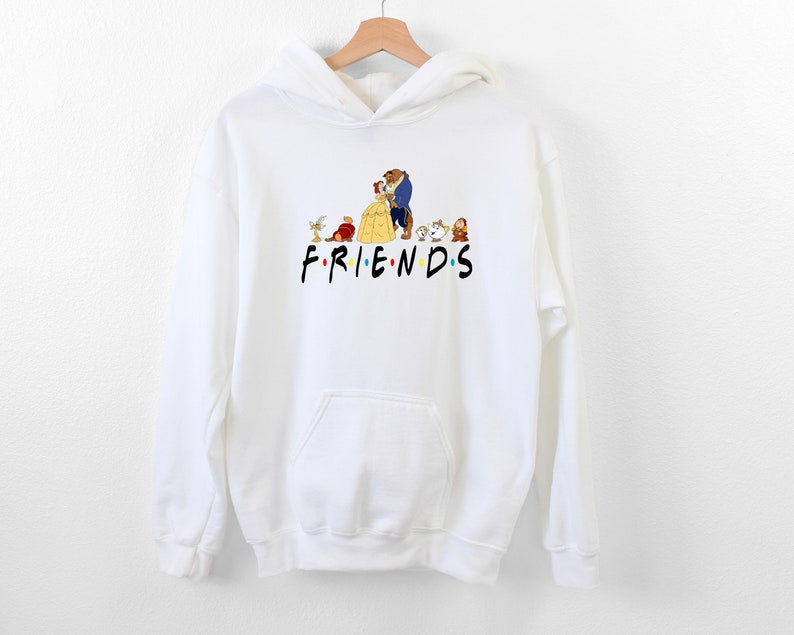 May include: White hoodie with a graphic of Belle and the Beast from Beauty and the Beast, along with other characters from the movie. The text "FRIENDS" is printed below the graphic.