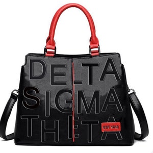 Delta  Sigma Theta Black leather handbag w/ matching wallet! Super cute!