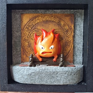 Calcifer miniatuur fanart, howl's bewegende kasteeldoosframe, miniatuur studio ghibli, schaalmodel van Calcifer op de oven
