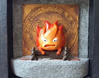 Calcifer miniature fan art, howl's moving castle box frame, miniature studio ghibli, scale model of Calcifer on the oven