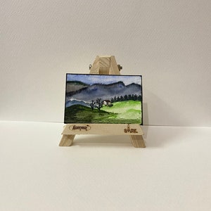 original miniature watercolour landscape painting, dollhouse painting with secluded house on a hill, a landscape painting/ dollhouse