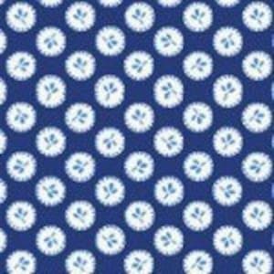 May include: A repeating pattern of white circles with a small blue and green floral design on a dark blue background.