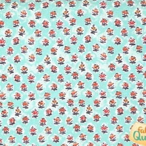 May include: A teal fabric with a repeating pattern of small, red, orange, and white flowers.