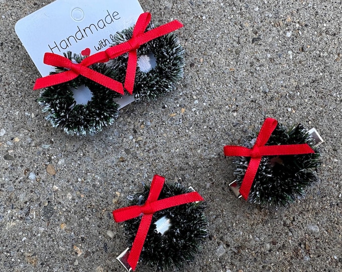 Christmas wreath shaped earrings or hair clips with a red bow, winter hair accessories