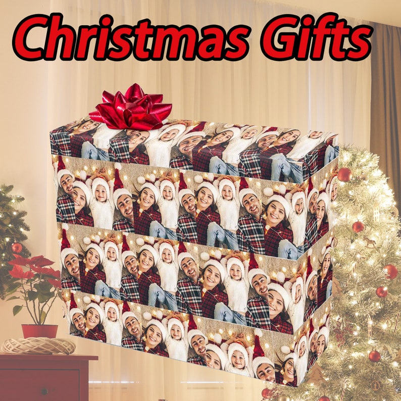 May include: A Christmas gift wrapping paper with a repeating pattern of a family of three wearing Santa hats. The paper is brown with a white and red plaid pattern. The family is smiling and looking at the camera. The text "Christmas Gifts" is at the top of the image.