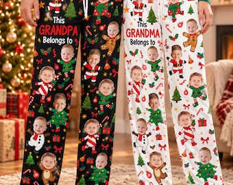 May include: Two pairs of pajama pants, one black and one white, featuring a repeating pattern of Christmas-themed illustrations and a child's face. The black pants read This GRANDPA Belongs to, and the white pants read This GRANDMA Belongs to.