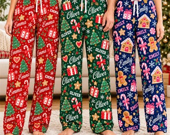 May include: Three pairs of lounge pants with drawstring waists, featuring festive holiday patterns. The red pair is printed with 'Emma', the green pair with 'Oliver', and the navy blue pair with 'Emily', alongside Christmas trees, gifts, and candy canes.