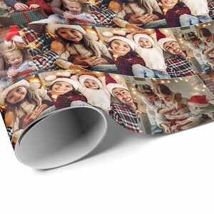 May include: A festive Christmas wrapping paper design featuring a collage of photos of a family wearing Santa hats and smiling. The paper has a red and black plaid pattern.
