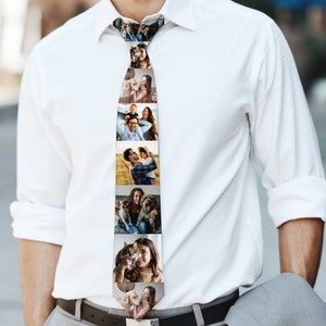 May include: A tie with a vertical pattern of photos featuring a family with their pets. The photos include a couple, a man holding a child, a woman with a cat, and a woman with a dog.