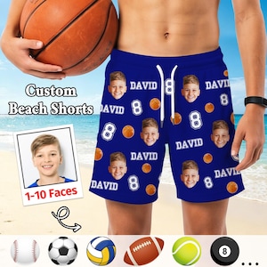 May include: Blue beach shorts featuring a repeating pattern of a boy's face, the name David, the number 8, and basketball graphics. The shorts include a white drawstring at the elastic waistband. Text on the image reads Custom Beach Shorts.
