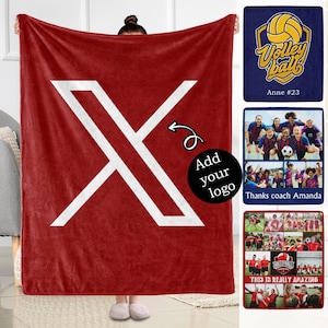 May include: Red fleece blanket with a white X design. The text "Add your logo" is in a black circle. The blanket is being held by a person.