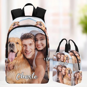 May include: A personalized backpack and lunch bag set featuring a couple and their dog. The backpack and lunch bag are both white with a black trim and have a photo collage of the couple and their dog on the front. The text "Cheste" is printed on both items.