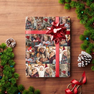 May include: A red and white Christmas wrapping paper with a collage of family photos. The photos show a family celebrating Christmas together. The wrapping paper is tied with a red ribbon and bow.