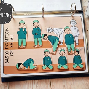 May include: A set of colourful illustrated cards showing the basic positions of Islamic prayer, or Salah. The cards are labelled with the Arabic words for each position, including 'Qiyam', 'Ruku', 'Sujud', and 'Tashahhud'.