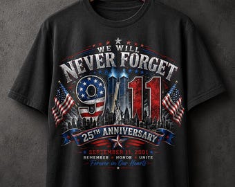 May include: A black short-sleeve t-shirt featuring a graphic design with the text WE WILL NEVER FORGET 9/11 25TH ANNIVERSARY SEPTEMBER 11, 2001 REMEMBER HONOR UNITE Forever in Our Hearts, two American flags, the Twin Towers, and the Statue of Liberty.