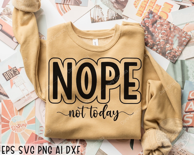 May include: A tan sweatshirt with the text "NOPE not today" in black lettering. The text is in a bold, outlined font.