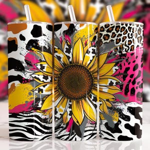May include: Three stainless steel tumblers with a colorful abstract design featuring a sunflower, zebra stripes, leopard print, and cow print. The tumblers have lids and straws.