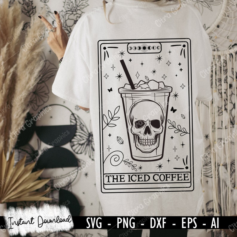 May include: A black and white illustration of a skull inside a cup of iced coffee. The illustration is surrounded by stars and other decorative elements. The text "THE ICED COFFEE" is below the cup.