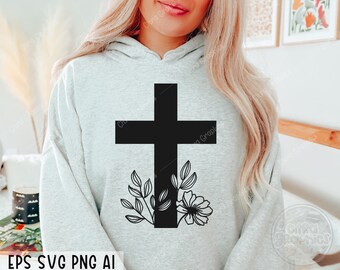 Può includere: Una felpa grigia con una croce nera decorata con accenti floreali. La croce è delineata in nero e ha un design semplice. I fiori sono stilizzati e hanno un aspetto delicato.
