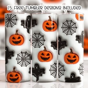 May include: Three white tumblers with a Halloween theme. The tumblers feature black and white spiderwebs, black ghosts, and orange pumpkins with jack-o-lantern faces. The text "15 FREE TUMBLER DESIGNS INCLUDED" is printed on the top of the tumblers.