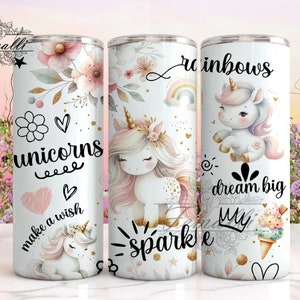 May include: Three white stainless steel tumblers with unicorn and rainbow designs. The tumblers feature gold glitter accents and phrases like "unicorns", "make a wish", "rainbows", "dream big", "sparkle", and "my".
