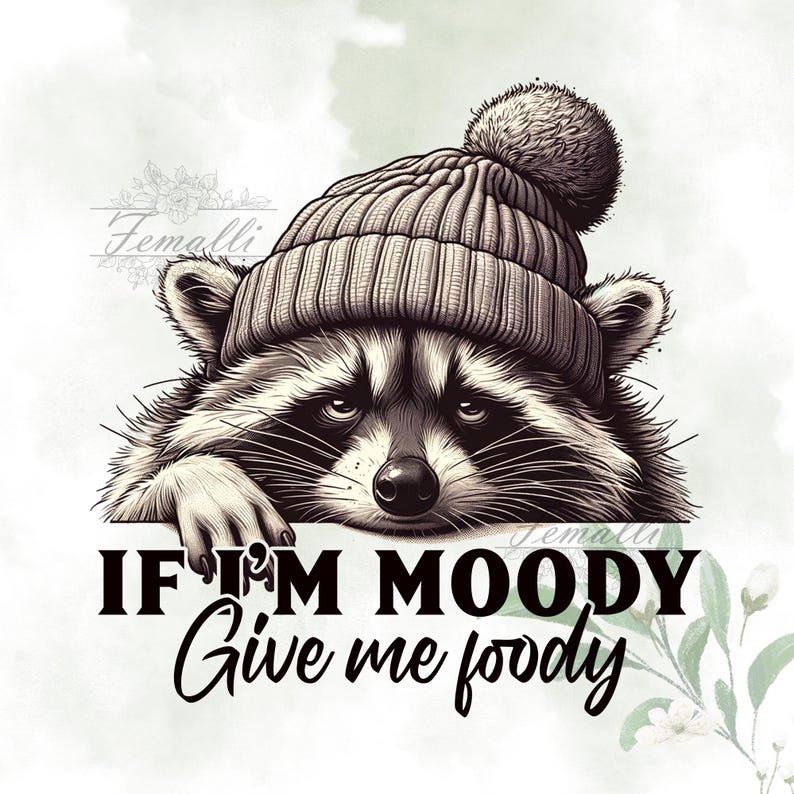 May include: A raccoon wearing a gray knit beanie with a white pom pom is looking at the camera. The raccoon is leaning on a white surface with the text "If I'm moody give me foody" printed on it.