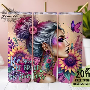 May include: Three stainless steel tumblers with a colorful design featuring a woman with a floral crown, butterflies, and sunflowers. The tumblers have the text "Be strong, be brave, be fearless" printed on them.