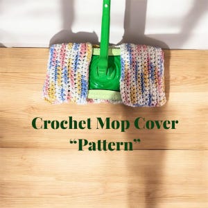 May include: A crochet mop cover in pink, blue, yellow, and white stripes. The cover is on a green mop head and the mop handle is green. The text "Crochet Mop Cover "Pattern"" is below the mop.