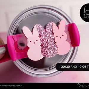 May include: Pink and glitter bunny-shaped tumbler lid topper for 20, 30, and 40 ounce tumblers. The lid topper is made of a laser-cut material and is ready to be used on a tumbler.
