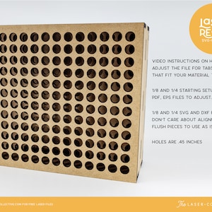 May include: A brown cardboard box with a grid of holes, each measuring 0.45 inches in diameter. The box is labeled "LASER READY SVG-EPS-DXF". The text below the label provides instructions on how to adjust the file for tabs and slots to fit different material thicknesses. It also mentions 1/8 and 1/4 starting setup with AI, PDF, EPS files to adjust, and 1/8 and 1/4 SVG and DXF files if you don't care about alignment or flush pieces to use as is.