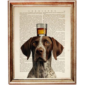 May include: A brown and white German Shorthaired Pointer dog with a glass of amber liquid on its head. The dog is looking directly at the viewer. The background is a vintage book page with text about chemistry.