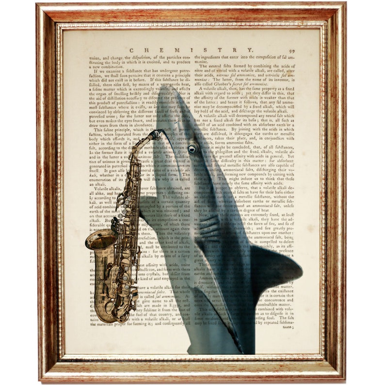 May include: A vintage book page with a blue shark playing a gold saxophone. The text on the page is from a book about chemistry.