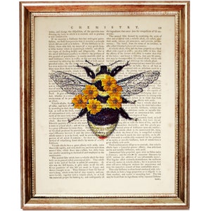 May include: A vintage book page with a black and yellow bumblebee surrounded by yellow flowers. The text on the page is about chemistry and the properties of volatile alkalis.