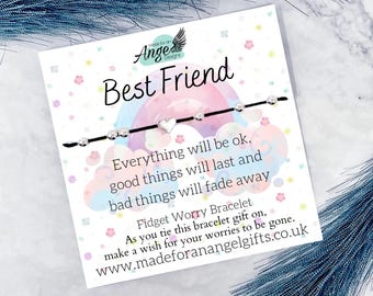 May include: A 'Best Friend' card with a black string bracelet featuring silver beads and a heart charm. The card has a rainbow design and text that reads, 'Everything will be ok, good things will last and bad things will fade away.'