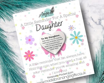 May include: A white card with the text "A Little Reminder For A Special Daughter" and a heart-shaped design. The card includes a message, decorative flowers, and the website www.madeforanangelgifts.co.uk.