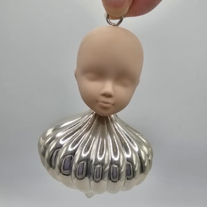 Upcycled doll head cupcake ornament