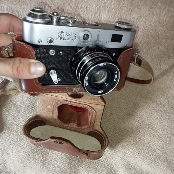 A working vintage Soviet film camera FED 3 Olympic with an Industar-61L/D f2.8 52 mm lens.35mm cameraUSSR.The M39 thread is identical Leica
