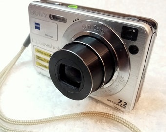 Sony Cybershot DSC-W120, Carl Zeiss optics, working camera, 4x zoom, 7.2 MP, stylish silver camera, dust curtains do not work,